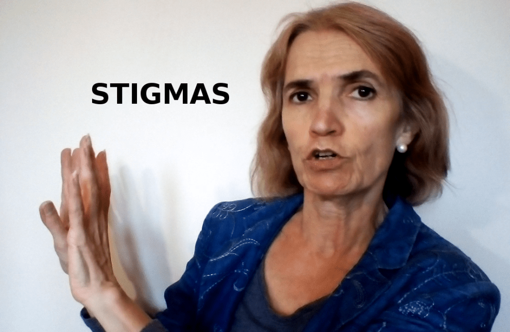 Angelina pushing something away, distancing herself; the word stigmas has been inserted into the photo